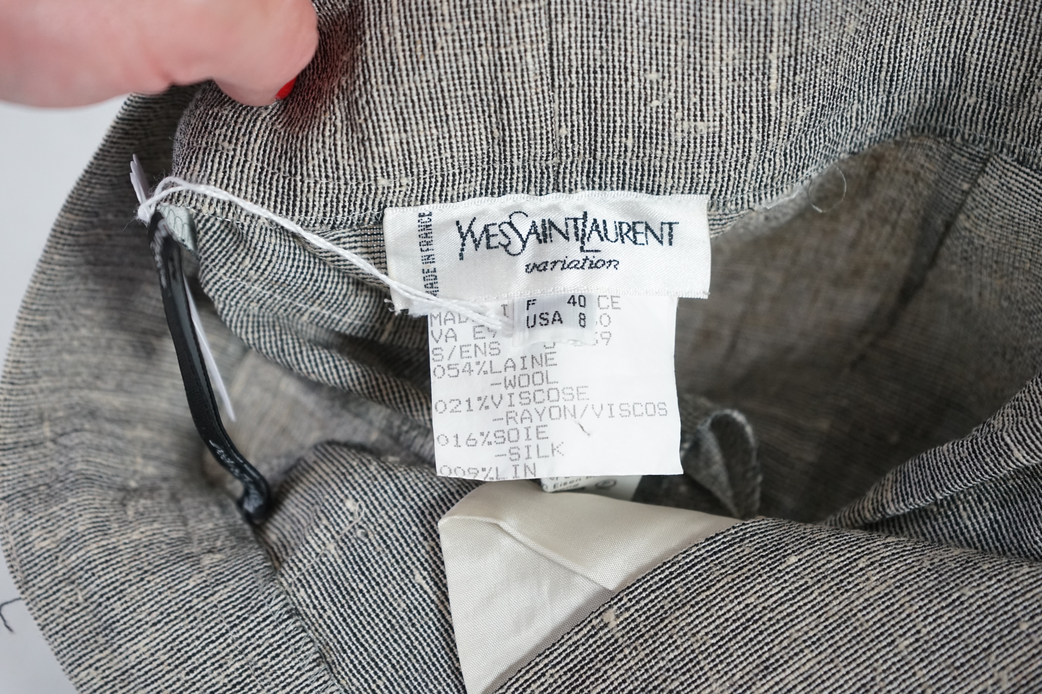 Two vintage Yves Saint Laurent variation lady's trouser suits, F 40 (UK 12). Please note alterations to make the waist smaller may have been carried out on some of the skirts. Proceeds to Happy Paws Puppy Rescue.
